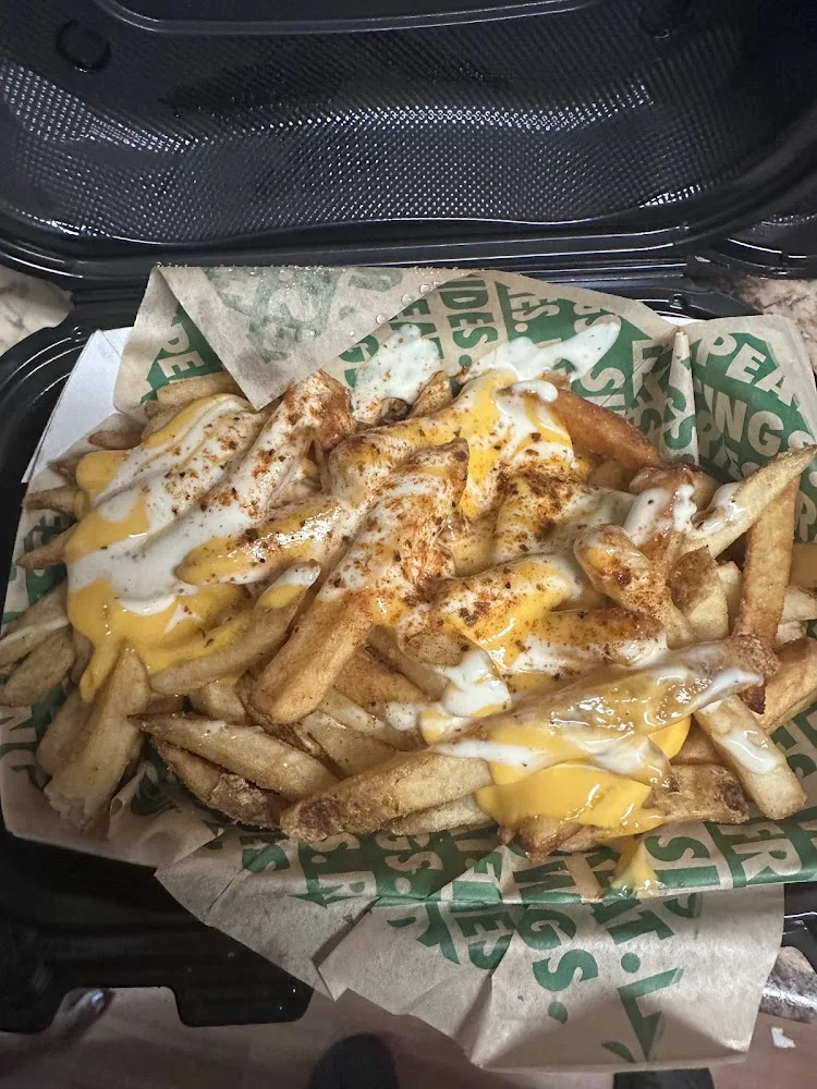 Wingstop food and storefront view at 3528 W Genesee Street in Syracuse, New York