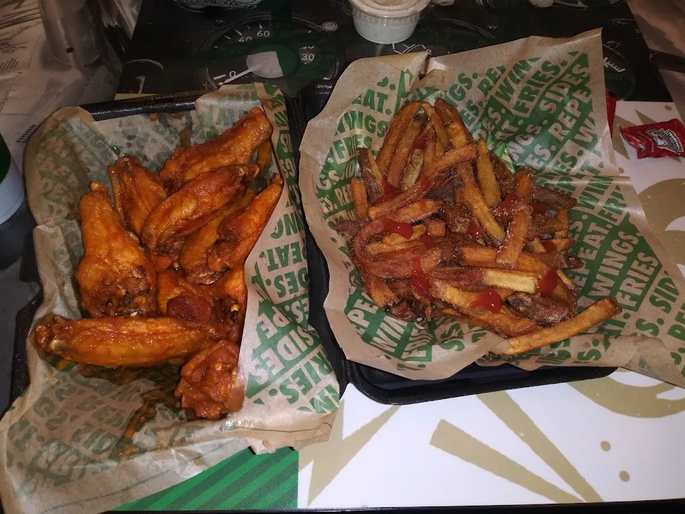 Wingstop food and storefront view at 2036 E 81St St in Tulsa, Oklahoma