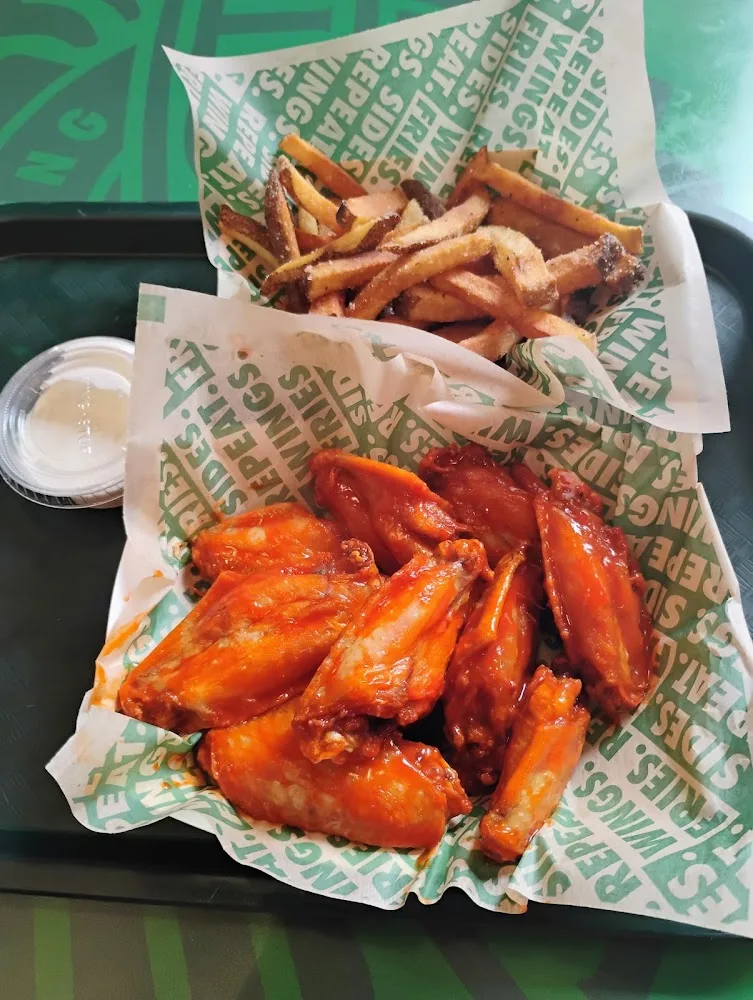 Wingstop food and storefront view at 2117 W. Burnside St. in Portland, Oregon