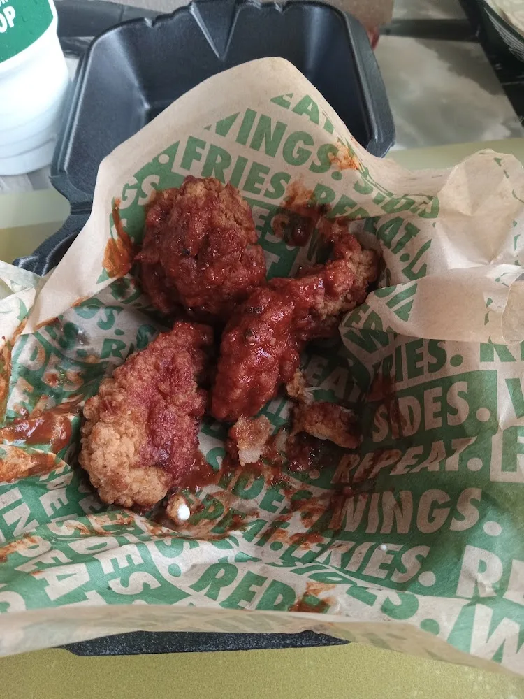 Wingstop food and storefront view at 1704 E. Stone Dr. in Kingsport, Tennessee
