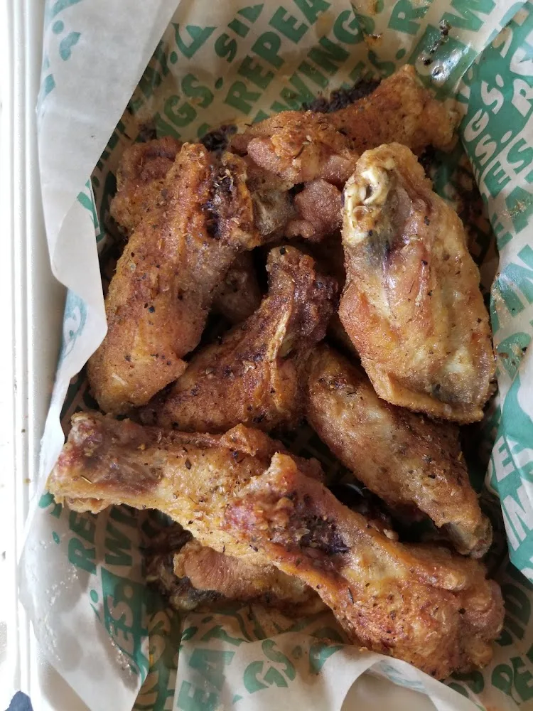 Wingstop food and storefront view at 3006 S. Rutherford Blvd Suite C in Murfreesboro, Tennessee