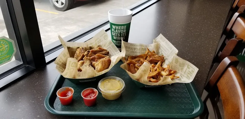 Wingstop food and storefront view at 5243 FM 521 Rd Ste O in Arcola, Texas