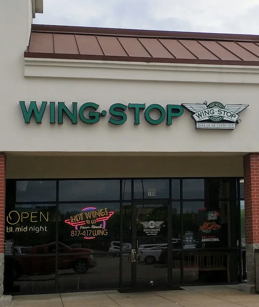 Wingstop food and storefront view at 2356 SE Green Oaks Blvd Ste 190 in Arlington, Texas
