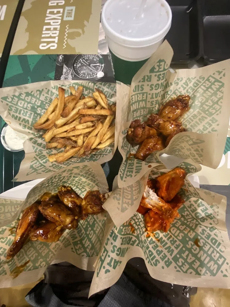 Wingstop food and storefront view at 6600 S. MoPac Expressway in Austin, Texas