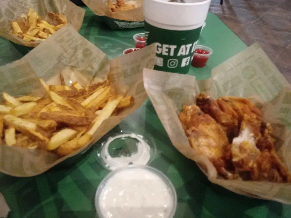 Wingstop food and storefront view at 5400 North IH 35 in Austin, Texas