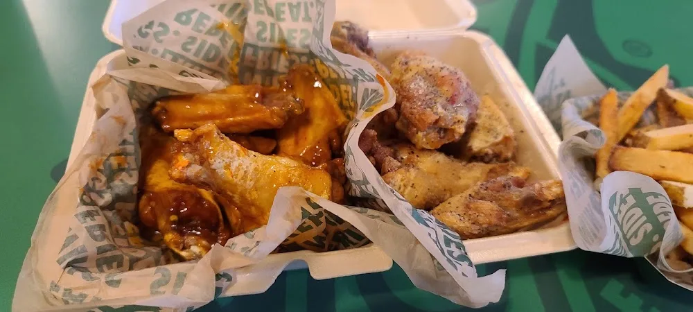 Wingstop food and storefront view at 8018 Hwy 146 N. Suite 6 in Baytown, Texas