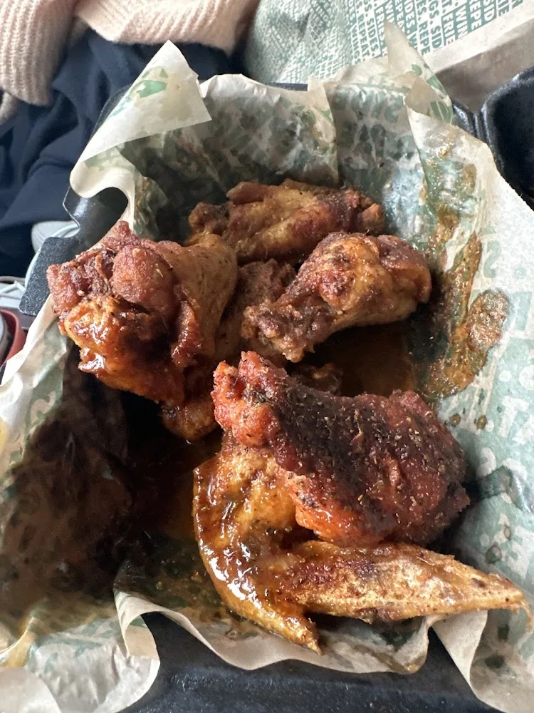 Wingstop food and storefront view at 3850 College Street Ste 200 in Beaumont, Texas