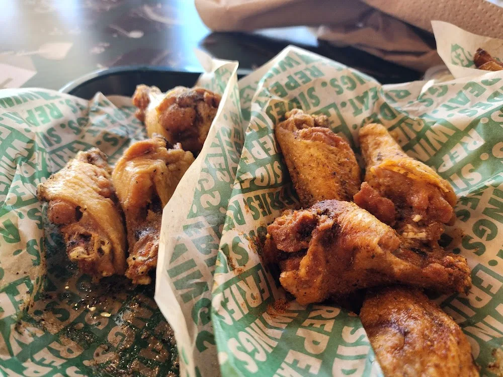 Wingstop food and storefront view at 2248 Central Drive in Bedford, Texas