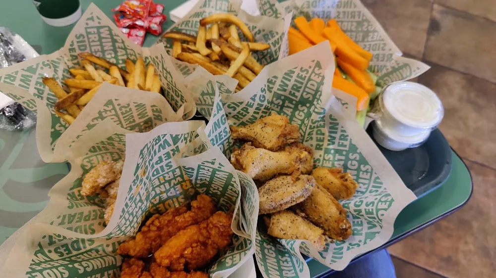 Wingstop food and storefront view at 2501 Paredes Line Rd Ste A3 in Brownsville, Texas