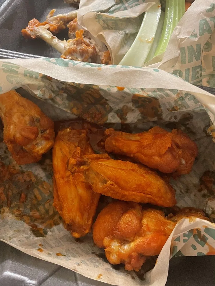 Wingstop food and storefront view at 2642 Tx-36 in Brenham, Texas