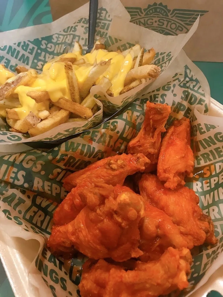 Wingstop food and storefront view at 8723 US Hwy 377 in Benbrook, Texas
