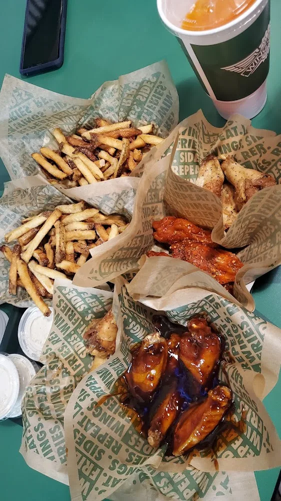 Wingstop food and storefront view at 2950 Southmost Rd Ste 106 in Brownsville, Texas