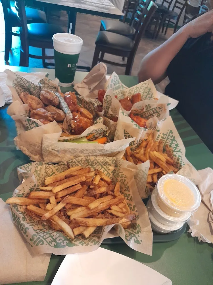 Wingstop food and storefront view at 1905 Central Blvd in Brownsville, Texas