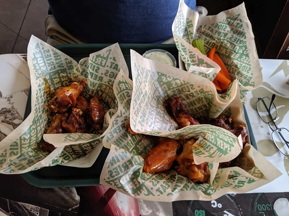 Wingstop food and storefront view at 1912 E Belt Line Rd in Carrollton, Texas