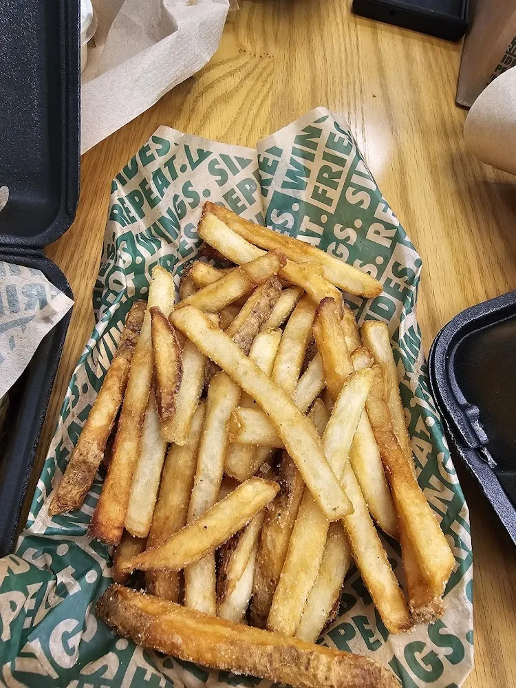 Wingstop food and storefront view at 2810 Trinity Mills Rd in Carrollton, Texas