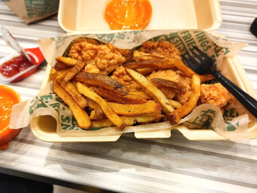 Wingstop food and storefront view at 8000 TX-242 #113B in Conroe, Texas