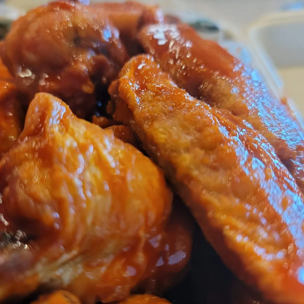 Wingstop food and storefront view at 381 S Loop 336 W. in Conroe, Texas