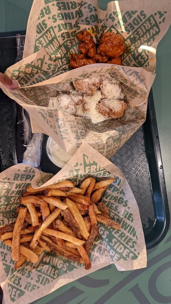 Wingstop food and storefront view at 11659 FM 2154 in College Station, Texas