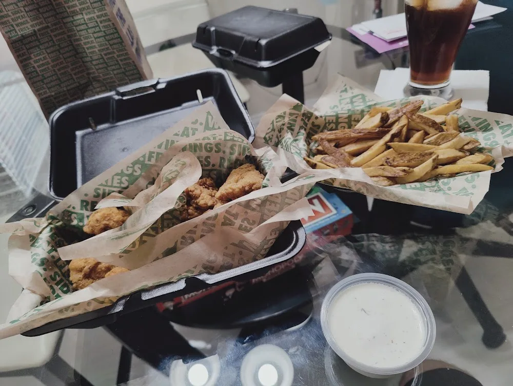 Wingstop food and storefront view at 3961 FM 2181 Suite B in Corinth, Texas