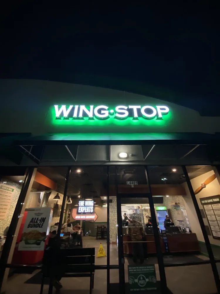 Wingstop food and storefront view at 14405 FM 2100 Suite E in Crosby, Texas