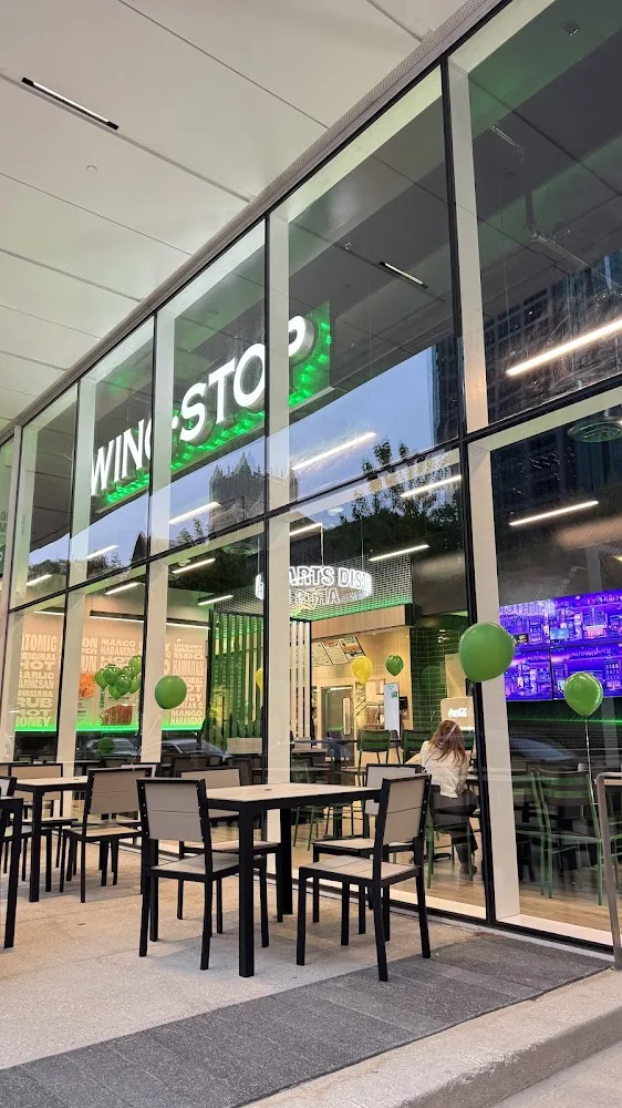 Wingstop food and storefront view at 800 N Harwood St in Dallas, Texas