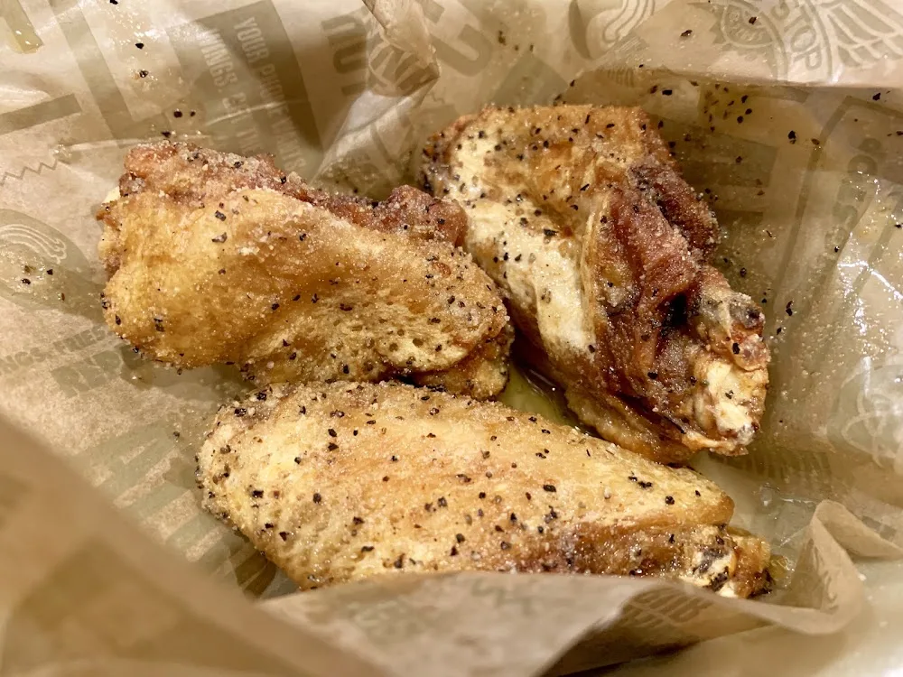 Wingstop food and storefront view at 4411 Lemmon Ave Ste 100 in Dallas, Texas