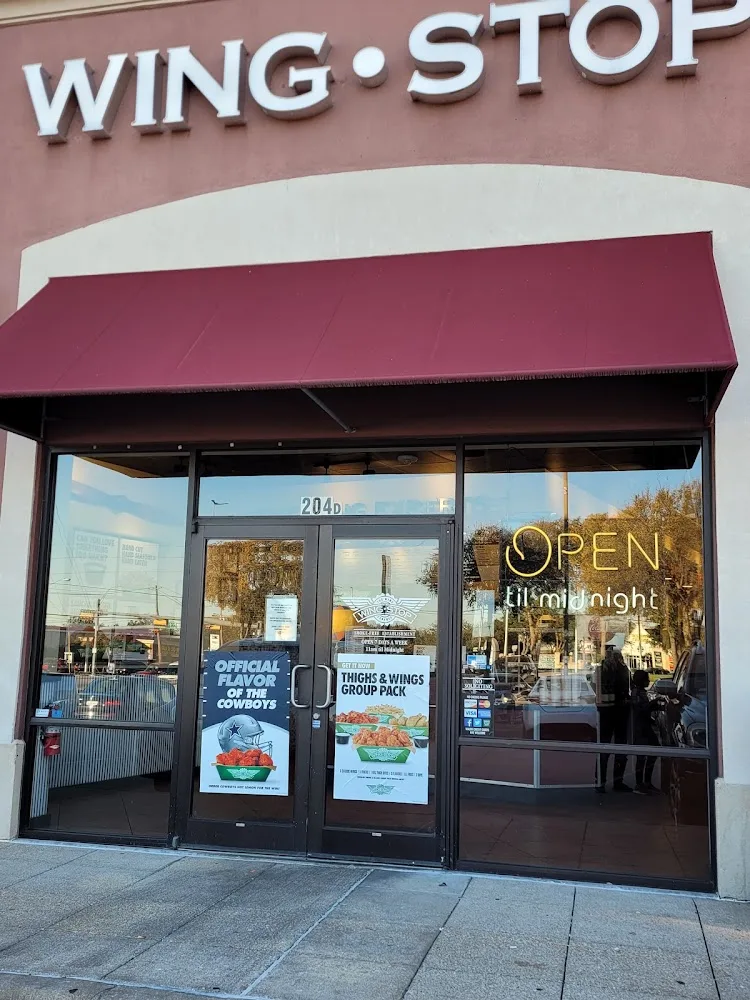 Wingstop food and storefront view at 18101 Preston Rd. #204 D in Dallas, Texas