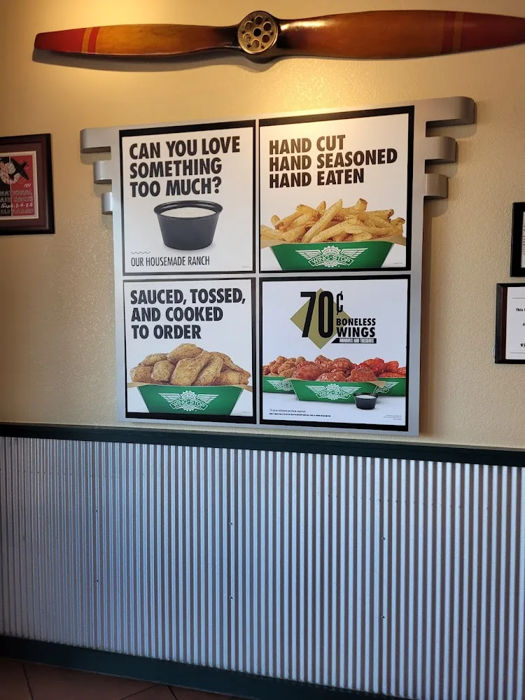 Wingstop food and storefront view at 18101 Preston Rd. #204 D in Dallas, Texas