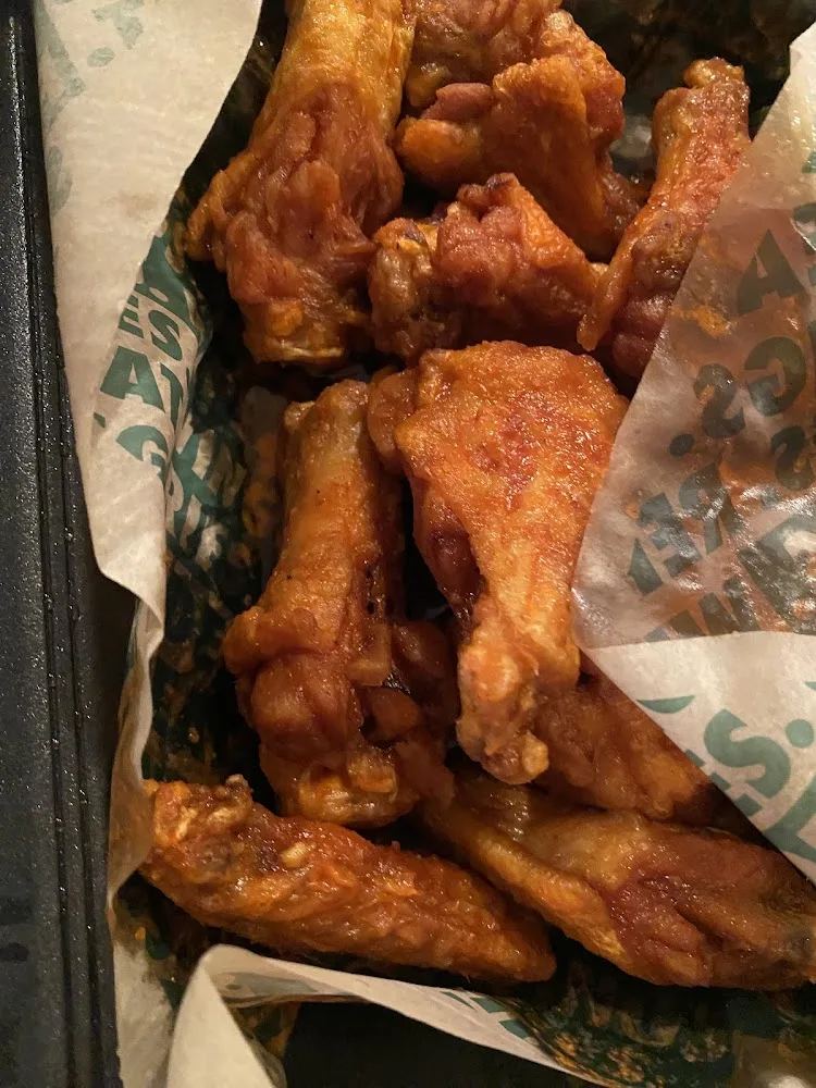 Wingstop food and storefront view at 6130 Greenville Ave Ste 108 in Dallas, Texas