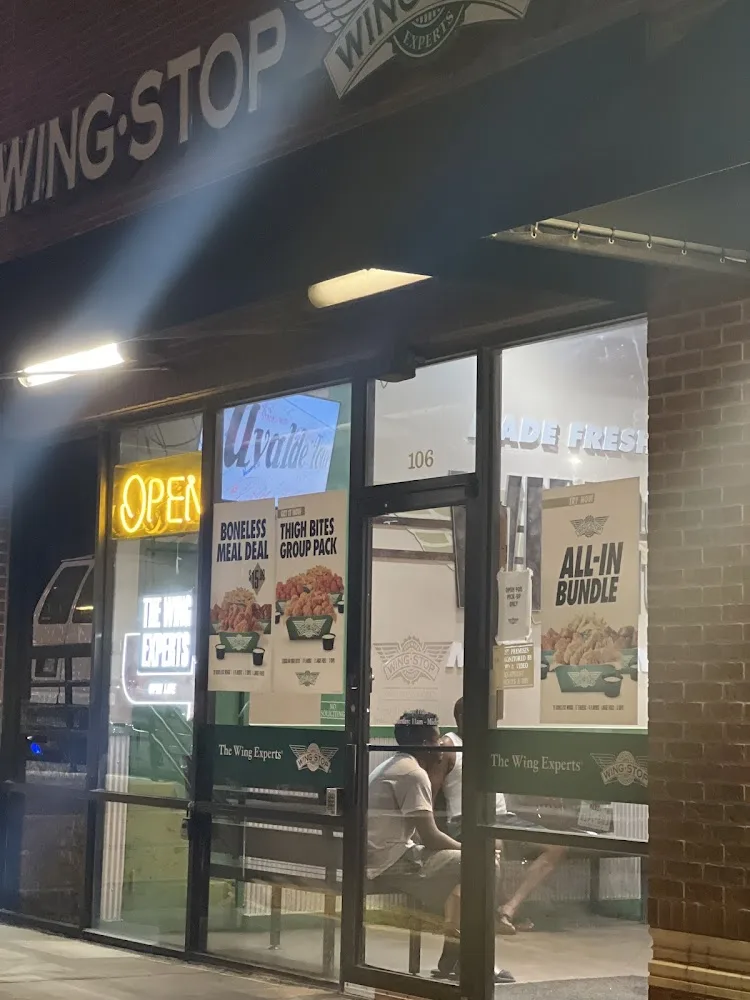 Wingstop food and storefront view at 3420 W Camp Wisdom Rd in Dallas, Texas