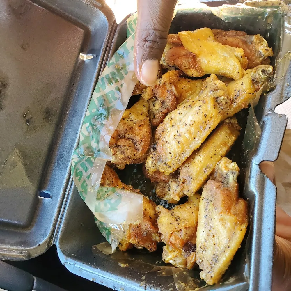 Wingstop food and storefront view at 1820 W. Mockingbird Ln in Dallas, Texas