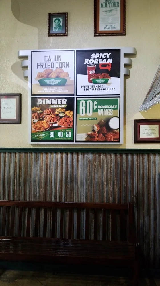 Wingstop food and storefront view at 1075 Wynnewood Village Shp Ctr in Dallas, Texas
