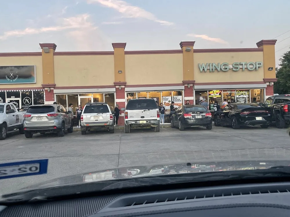 Wingstop food and storefront view at 2410 Duncanville Rd #108 in Dallas, Texas