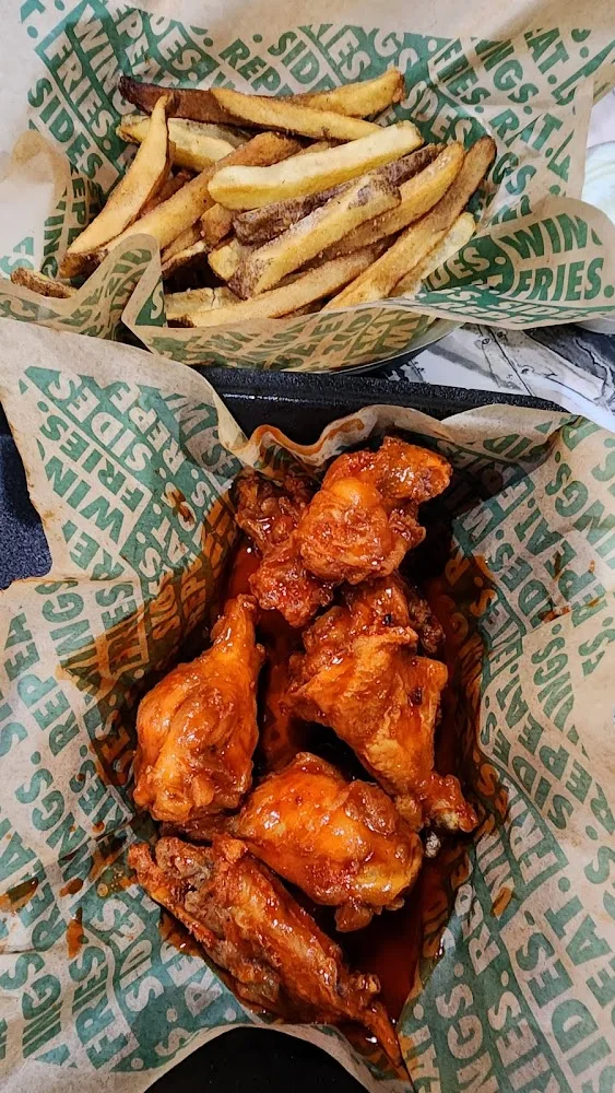 Wingstop food and storefront view at 5334 Ross Ave Ste 600 in Dallas, Texas