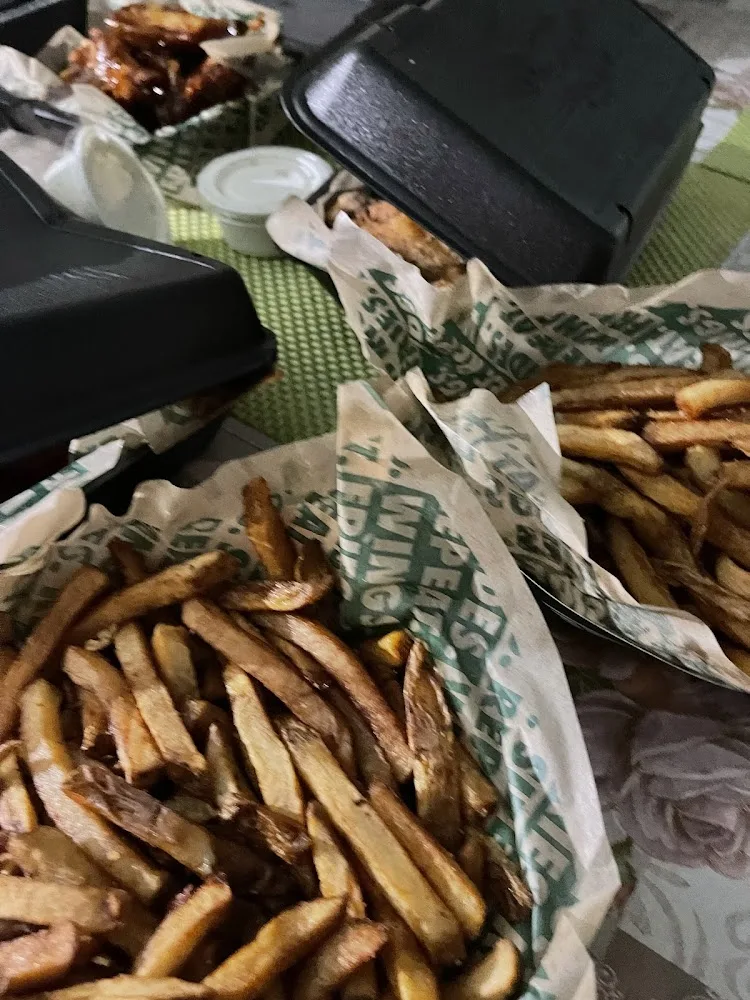 Wingstop food and storefront view at 2627 W Jefferson Blvd Ste 214 in Dallas, Texas