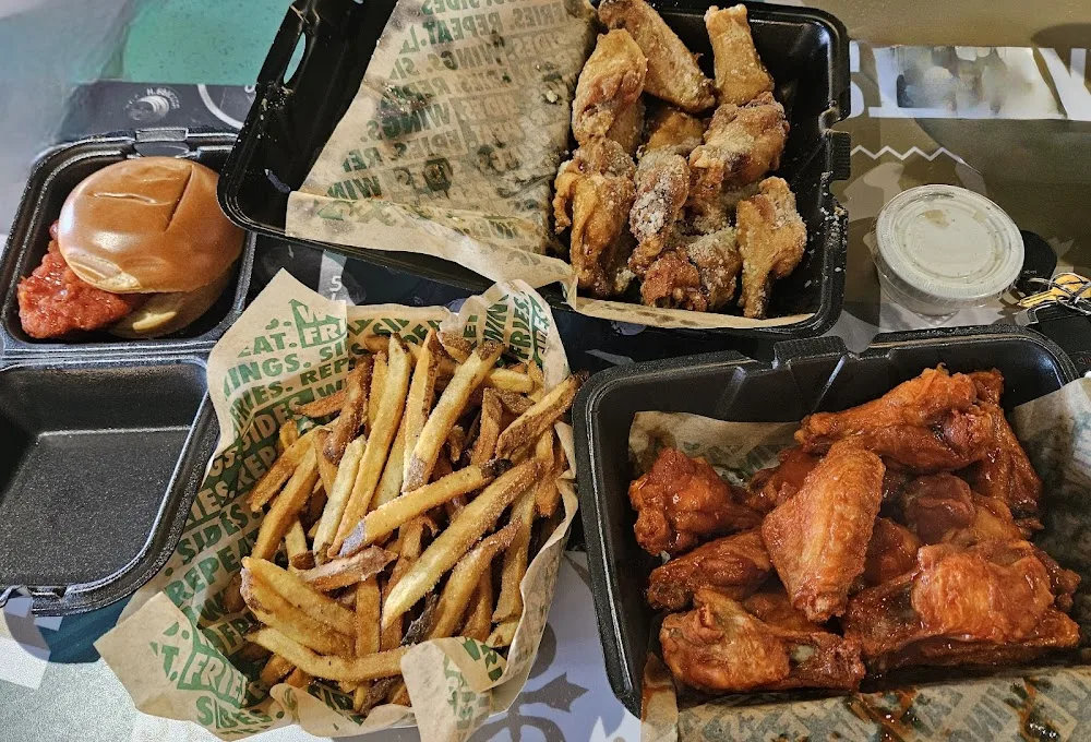 Wingstop food and storefront view at 1133 N. Zang Blvd in Dallas, Texas