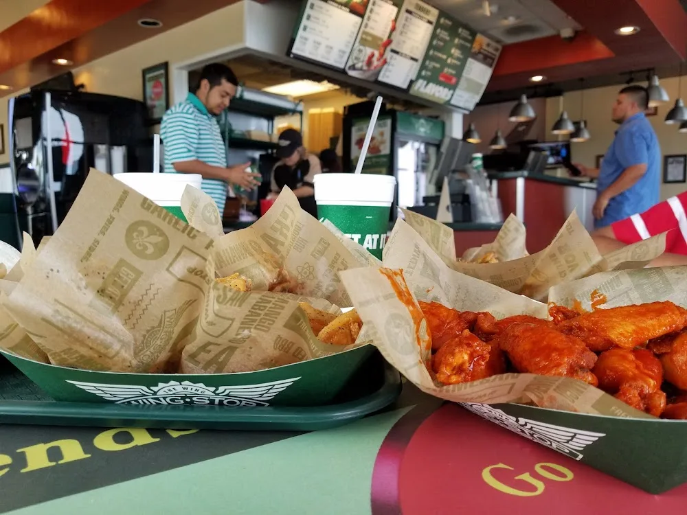 Wingstop food and storefront view at 4351 DFW Turnpike in Dallas, Texas