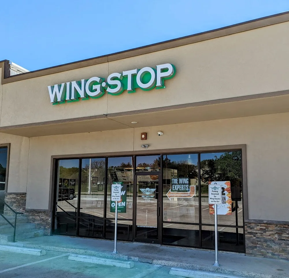 Wingstop food and storefront view at 3730 E. McKinney St. Ste 106 in Denton, Texas