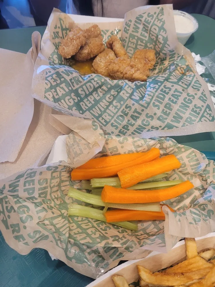 Wingstop food and storefront view at 1757 George Dieter Dr Ste 122 in El Paso, Texas