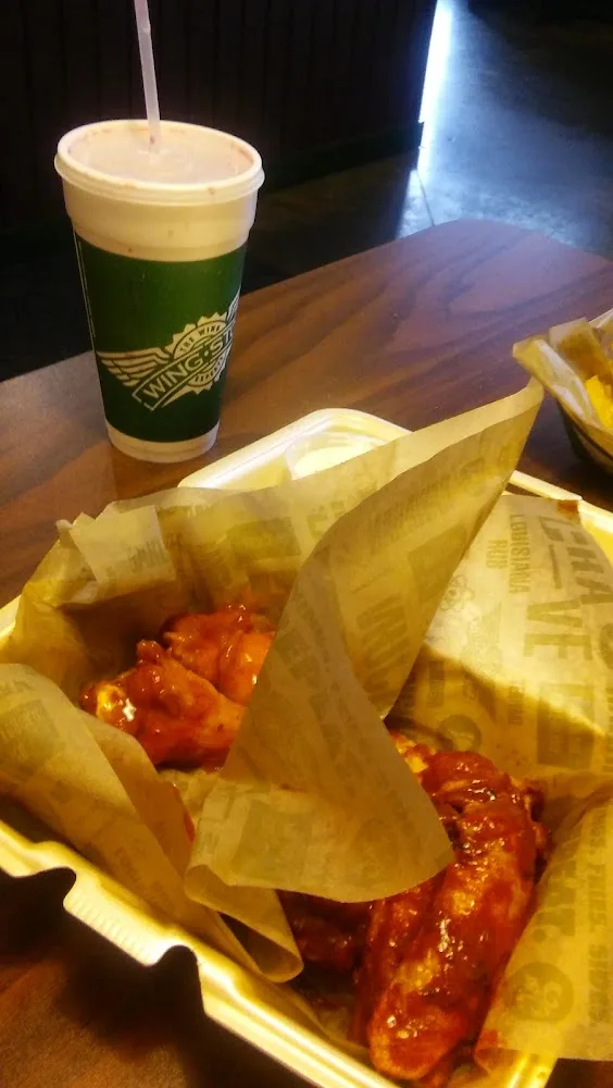 Wingstop food and storefront view at 2608 Flower Mound Rd in Flower Mound, Texas