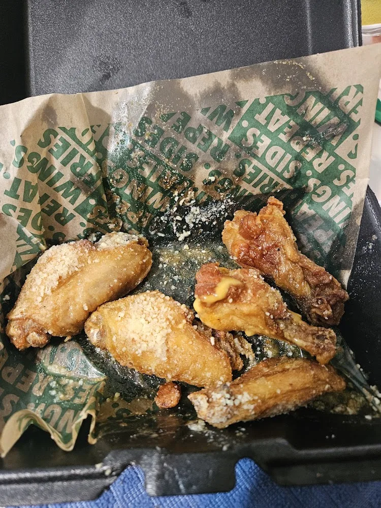 Wingstop food and storefront view at 6734 Forest Hill Dr in Forest Hill, Texas