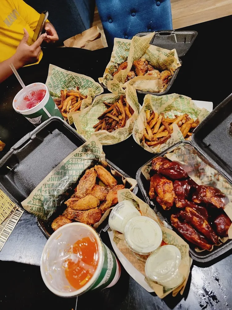 Wingstop food and storefront view at 301 Clifford Center Dr Ste 101 in Fort Worth, Texas