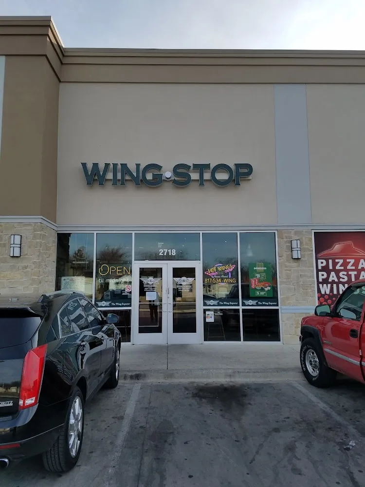 Wingstop food and storefront view at 2718 E Berry St in Ft Worth, Texas