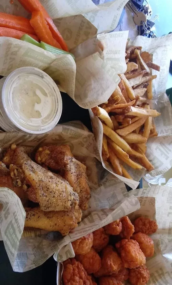 Wingstop food and storefront view at 6202 Broadway St Ste B in Galveston, Texas