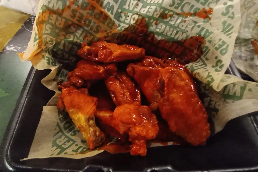 Wingstop food and storefront view at 928 N. Beltline Rd #200 in Grand Prairie, Texas
