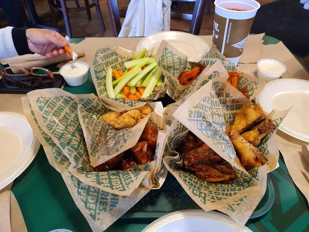 Wingstop food and storefront view at 1729 W Harrison Ave Ste B in Harlingen, Texas