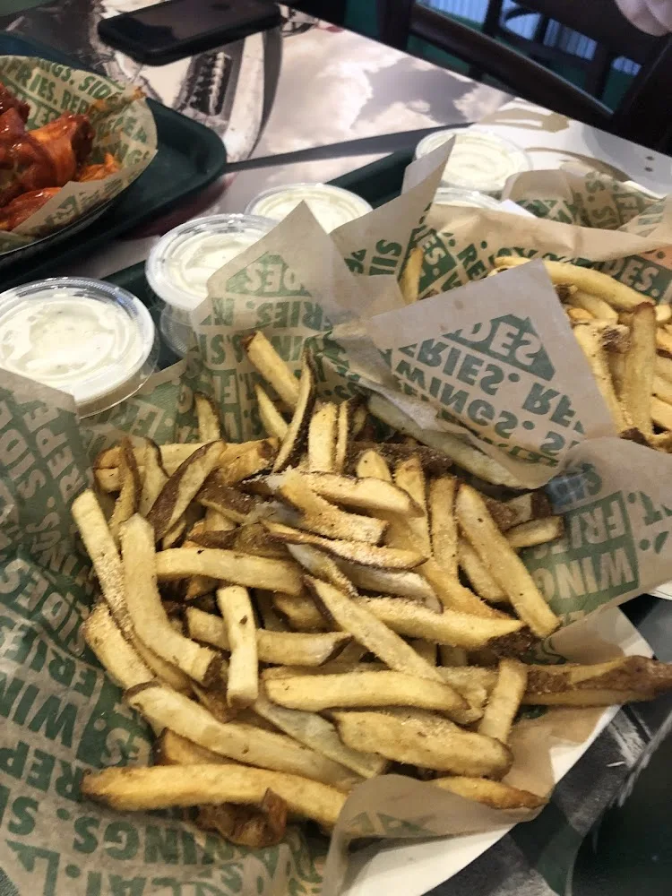 Wingstop food and storefront view at 2319 US Highway 79 in Henderson, Texas