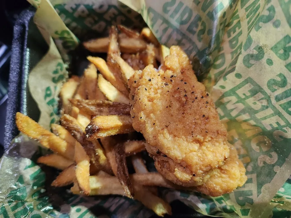 Wingstop food and storefront view at 9804 Jones Rd Ste A in Houston, Texas