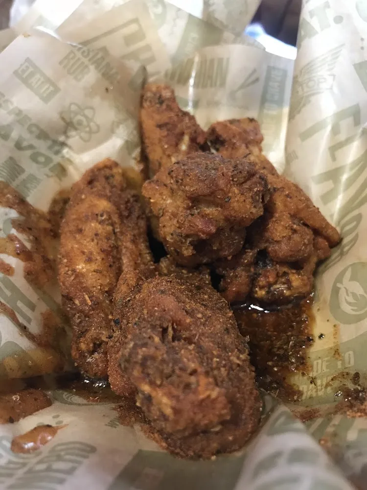 Wingstop food and storefront view at 8326 Broadway St in Houston, Texas