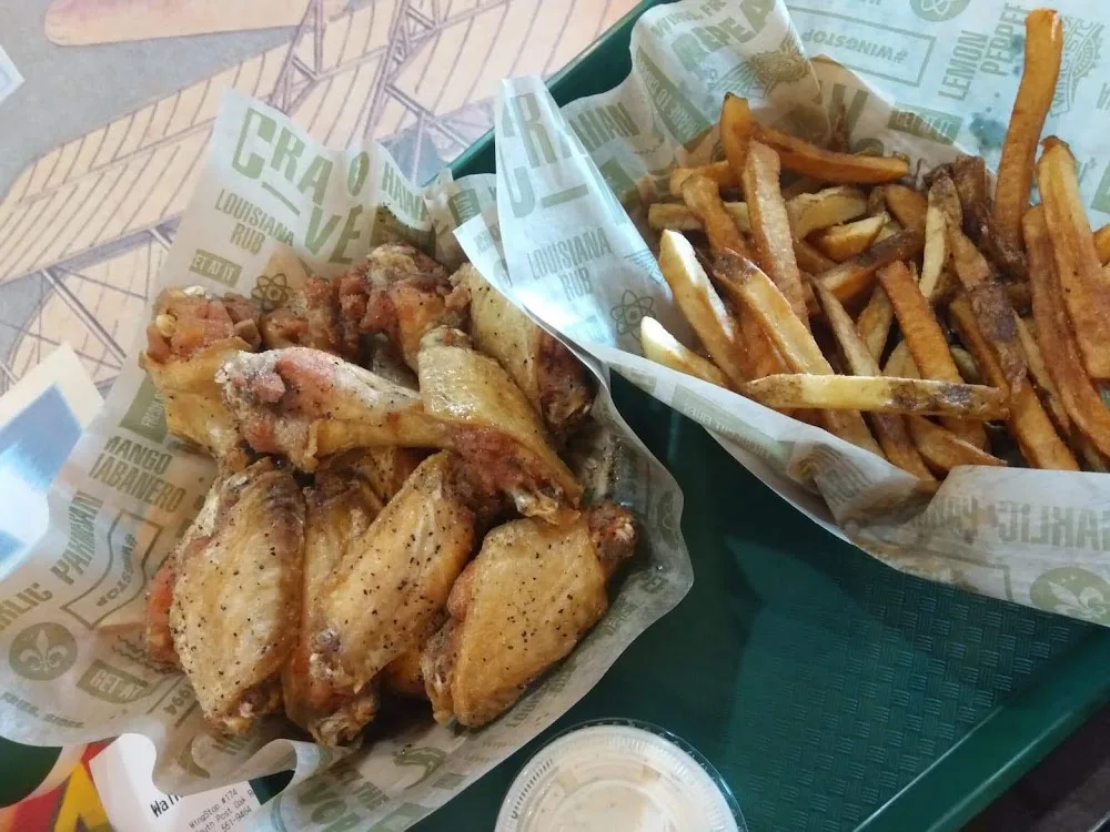 Wingstop food and storefront view at 10273 S Post Oak Rd in Houston, Texas